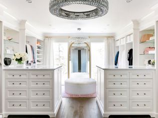 multiple chandeliers and recessed lights in closet