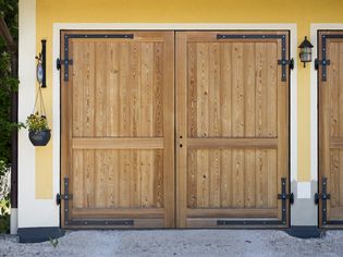 Side-hinged wood garage door.