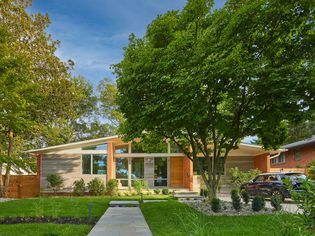 mid-century home with vaulted roof