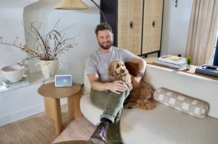 Bobby Berk in his living room with his dog