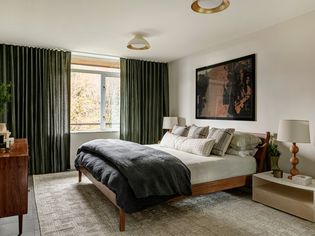 Bedroom in mid-century modern design with muted color palette.