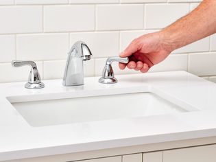 Leaky Delta faucet handle being turned