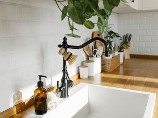 white kitchen sink with butcher block countertops