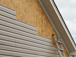 Vinyl siding installation on a house