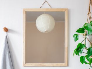 DIY framed mirror hanging on a wall