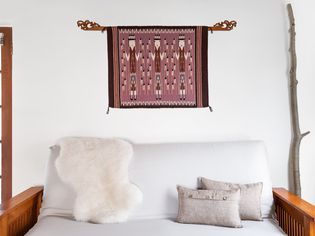 a rug mounted as artwork