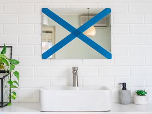 Front view of a bathroom mirror to be removed