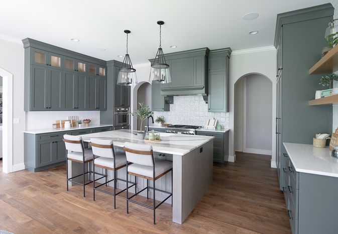 gray green cabinets and white backsplash