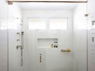 Bathroom in a basement with shortened windows