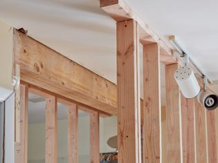 Load bearing wall with wood support beams 