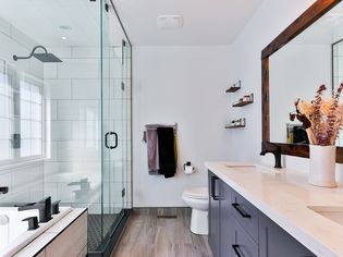 Modern bathroom with a shower that has a window within